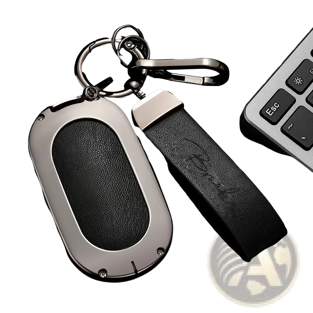Black leather key fob with sleek silver frame and embossed strap personalized as a custom engraved leather keychain gift