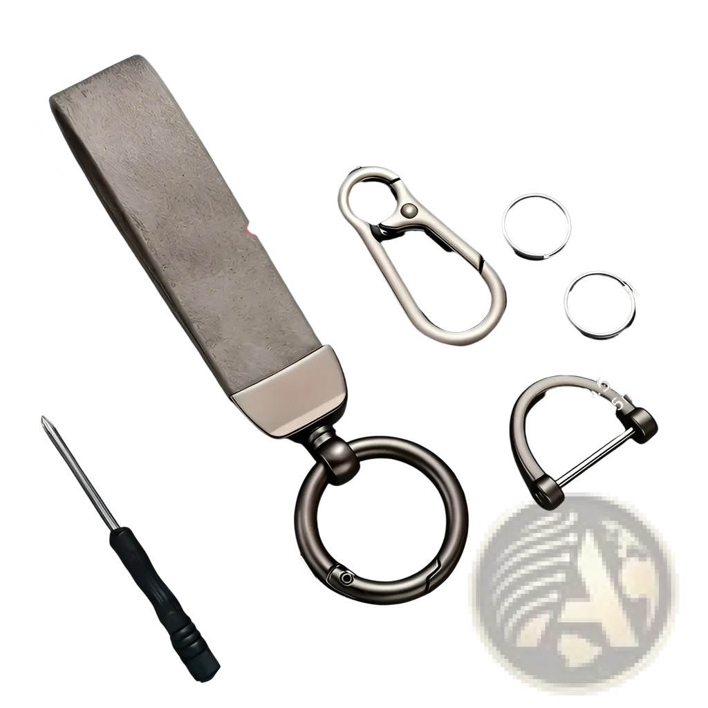 A sleek rectangular custom engraved leather keychain with textured gray stone top and polished silver metal base