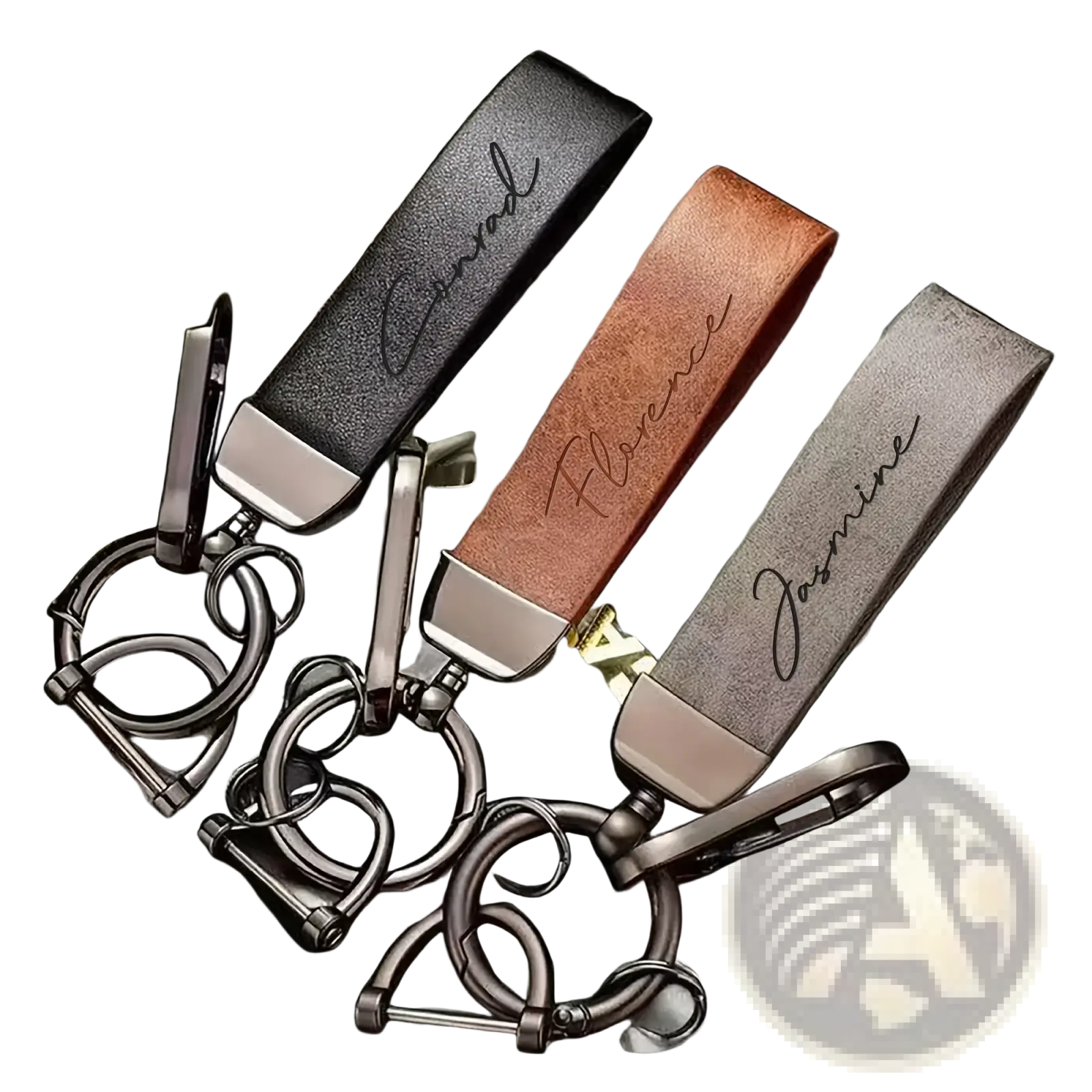 Three personalized brown leather keychains with custom engraved names and silver metallic hardware for gifts