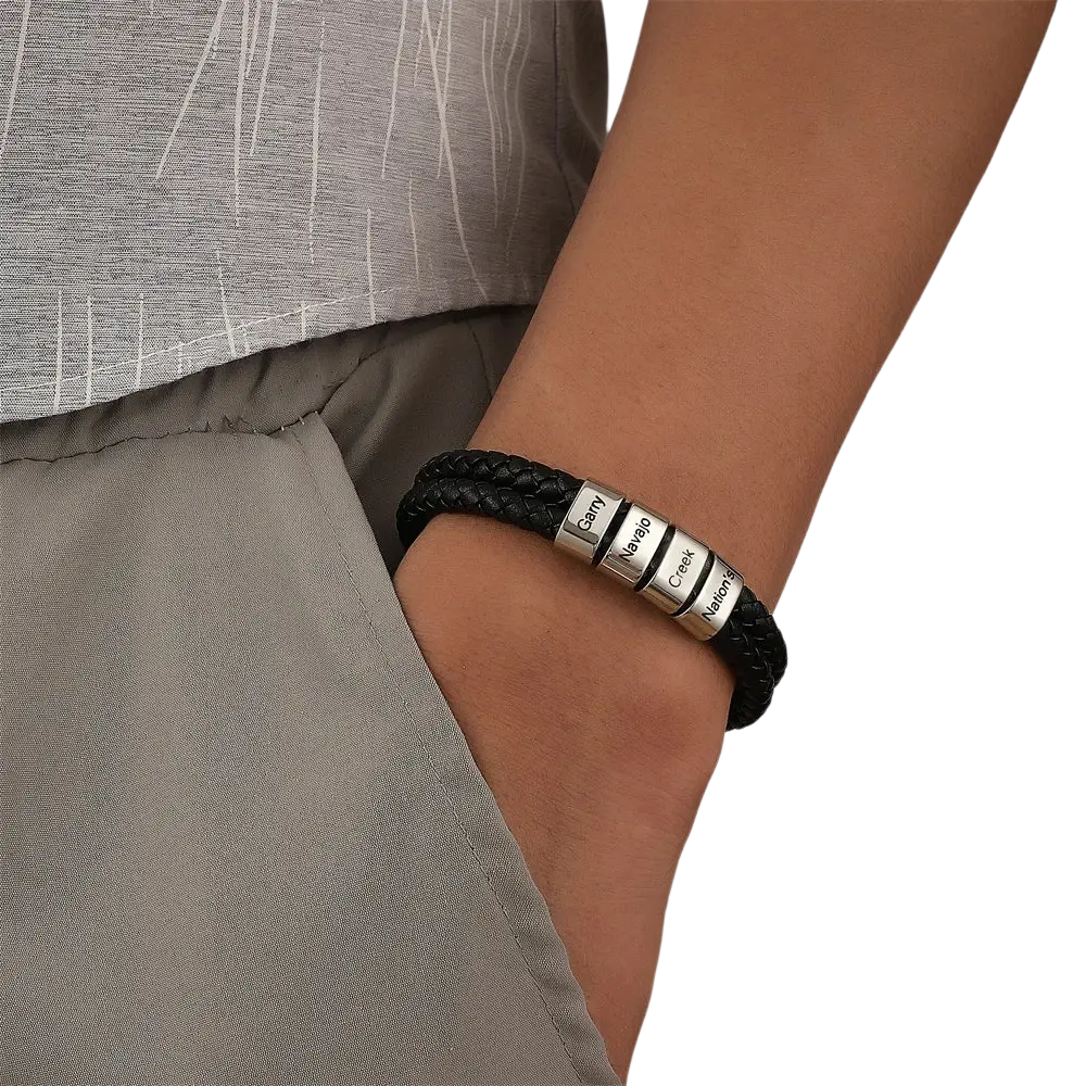 Custom engraved leather name bracelet for men featuring black braided leather and four silver magnetic name plates