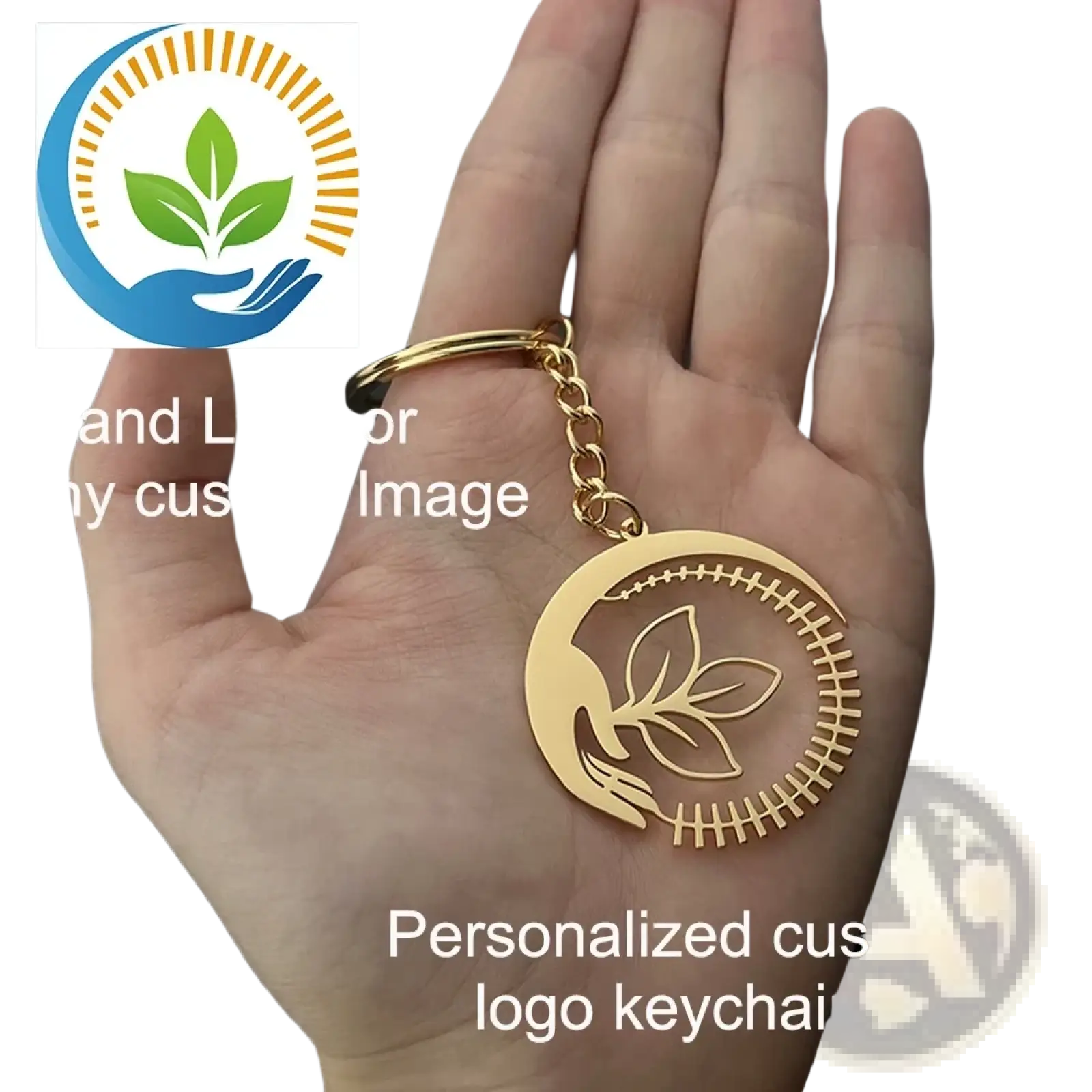 Gold-colored metal keychain with circular design engraved leaf motif and stitched border for personalized gifts