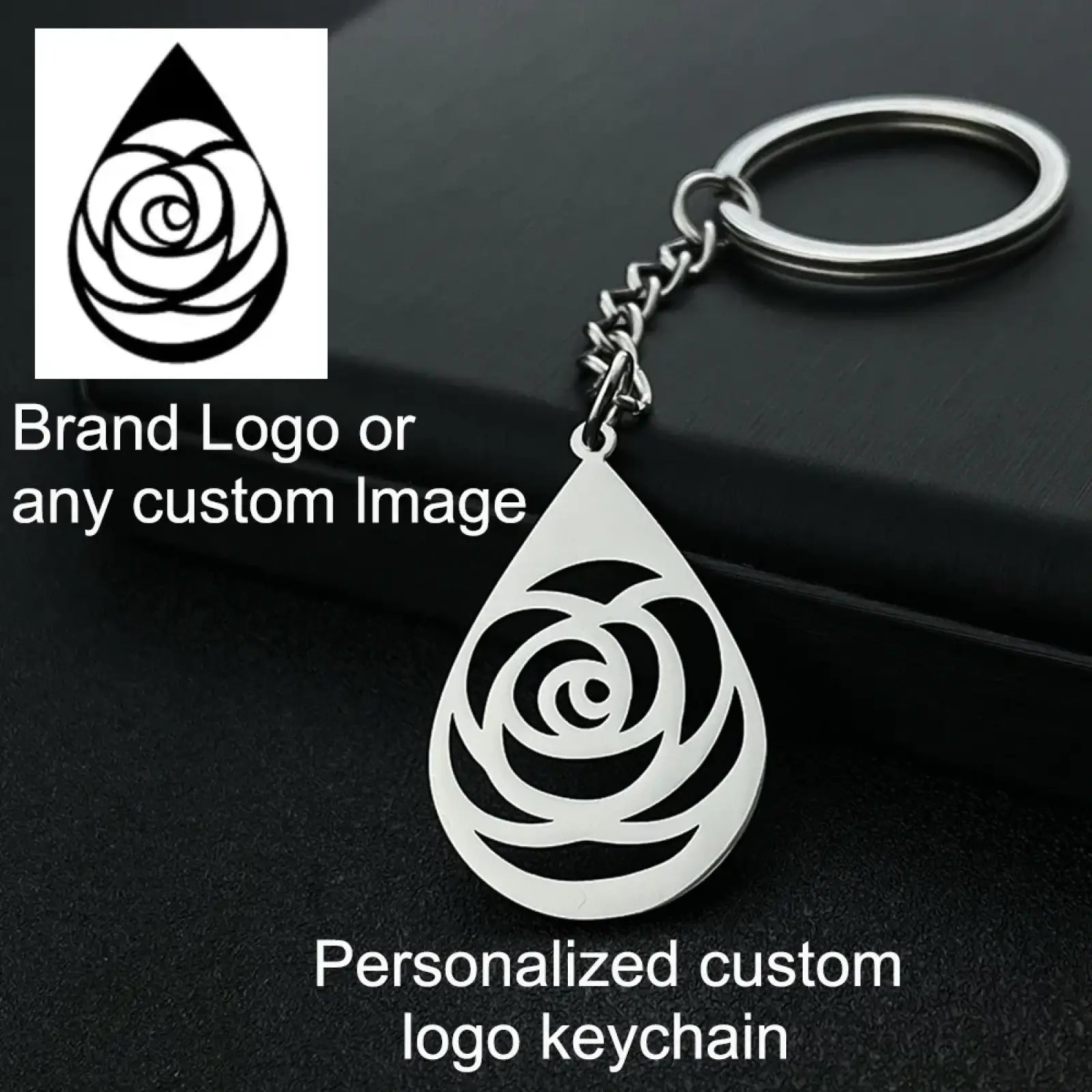 Silver teardrop-shaped metal keychain with intricate rose design cutout personalized gift engraving option
