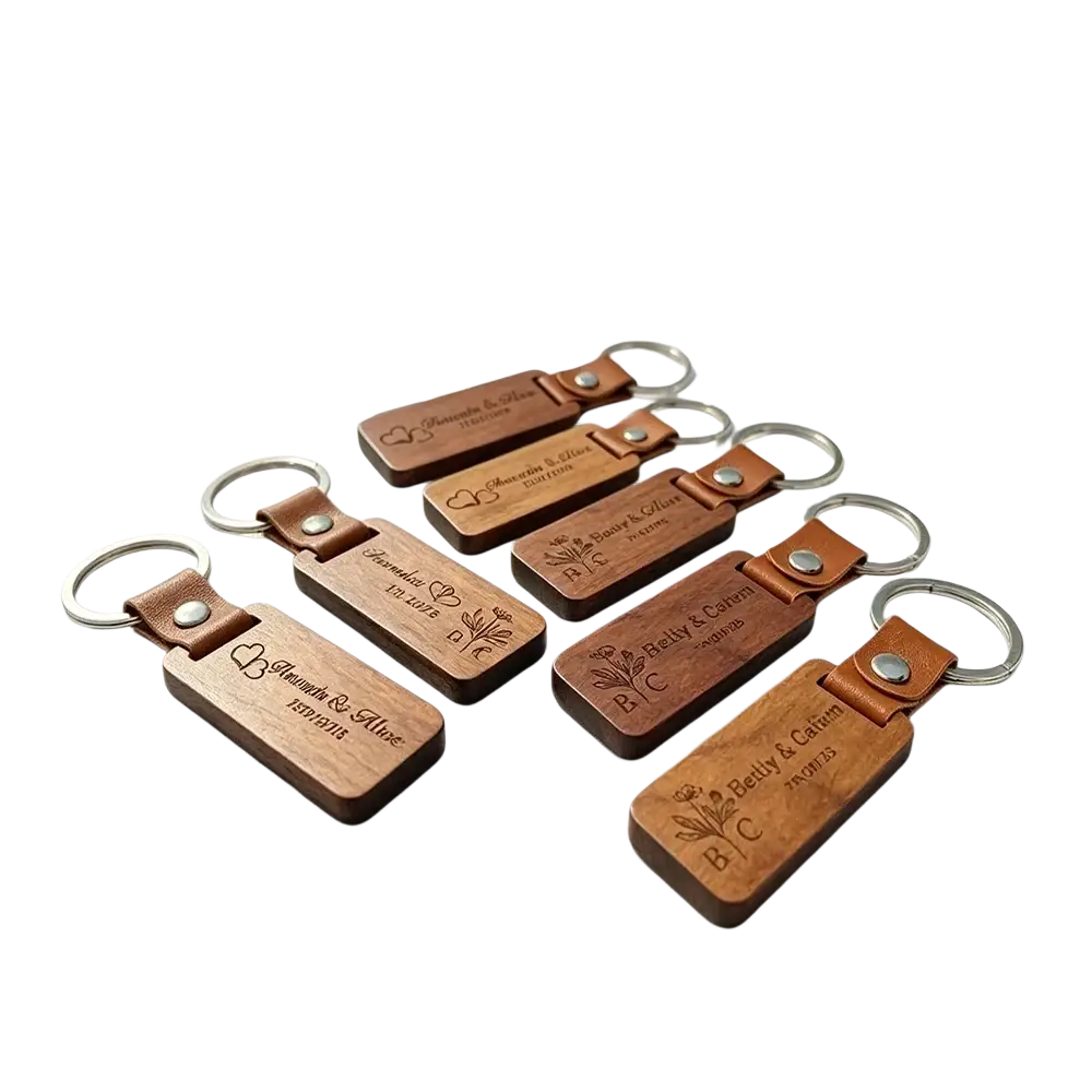 Custom engraved wooden leather keychains with silver rings featuring names dates and floral designs