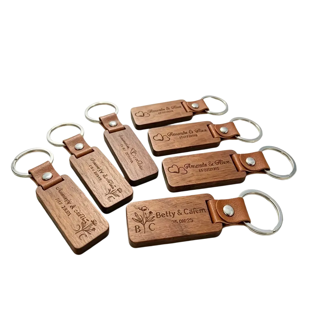 Custom engraved wooden leather keychain with silver metal ring featuring personalized names and dates on natural wood