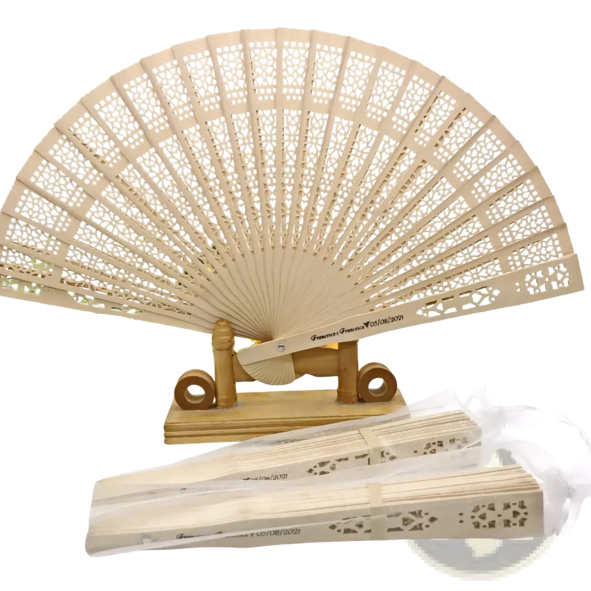 Beige wooden wedding fan with intricate lace-like cutouts and custom engraved text on the handle for favors