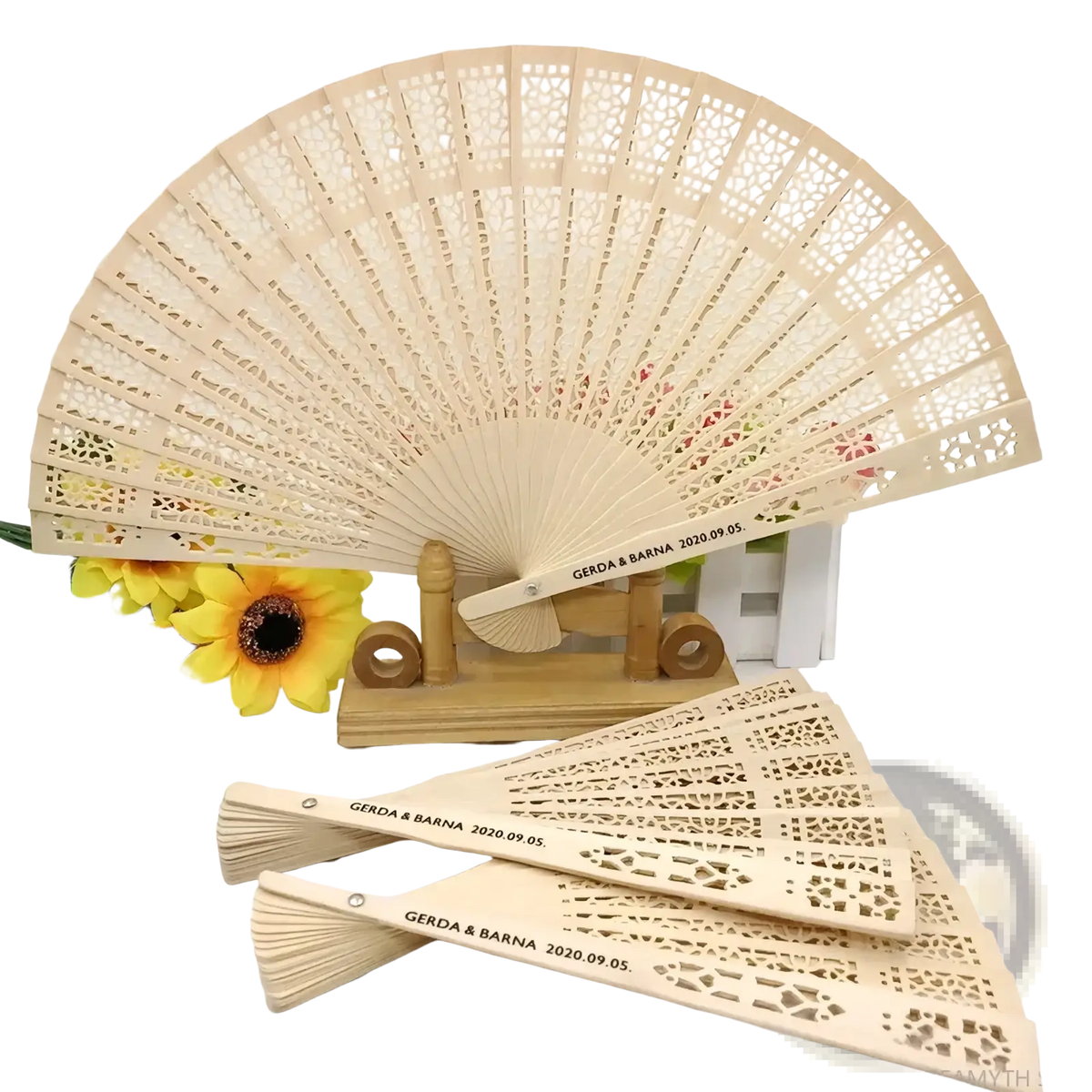 Beige wooden folding fan with intricate lace-like cutouts and custom engraved text for wedding fan favors
