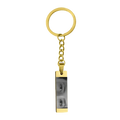Gold-colored stainless steel rectangular keychain engraved with custom black and white eye photograph