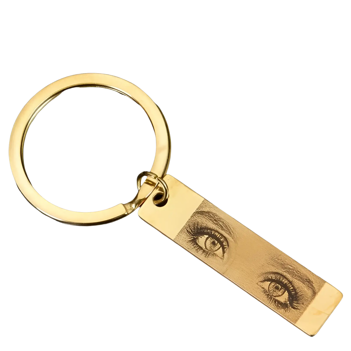 Gold-colored stainless steel keychain with a rectangular tag engraved with detailed realistic eyes for customization