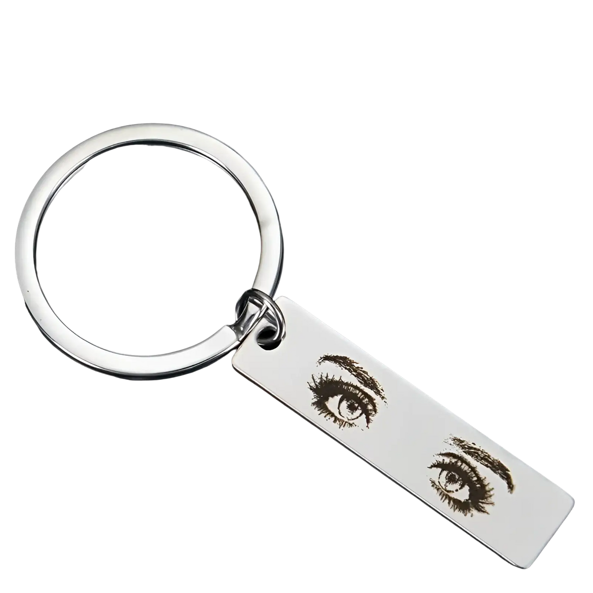 Silver rectangular stainless steel keychain with custom engraved detailed expressive eyes and long lashes design