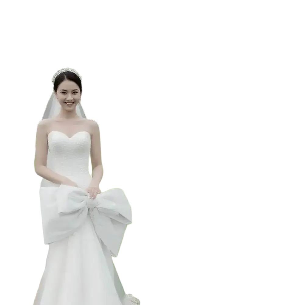 White satin wedding gown with a sweetheart neckline and large bow at the waist for a custom fabric wedding welcome sign