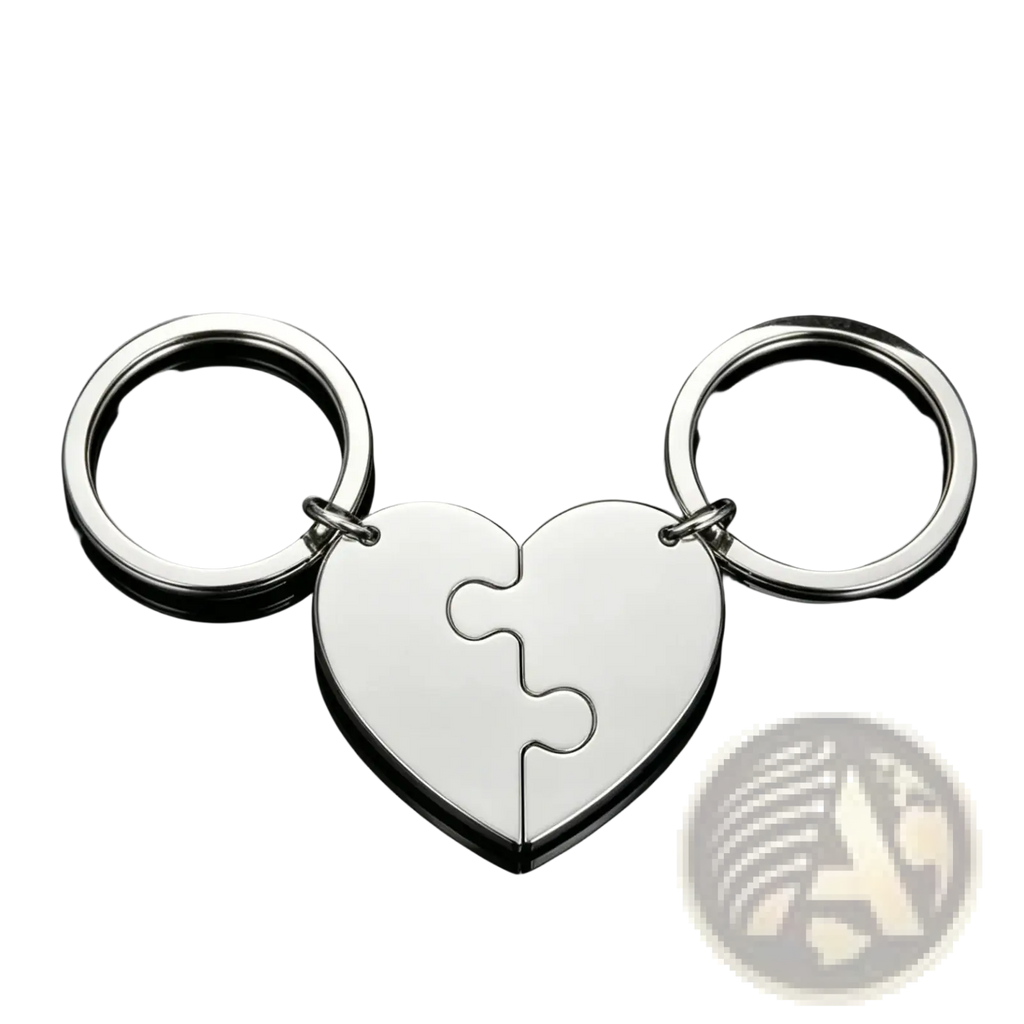 Silver custom family puzzle heart keychain with two interlocking puzzle-piece halves attached to circular rings