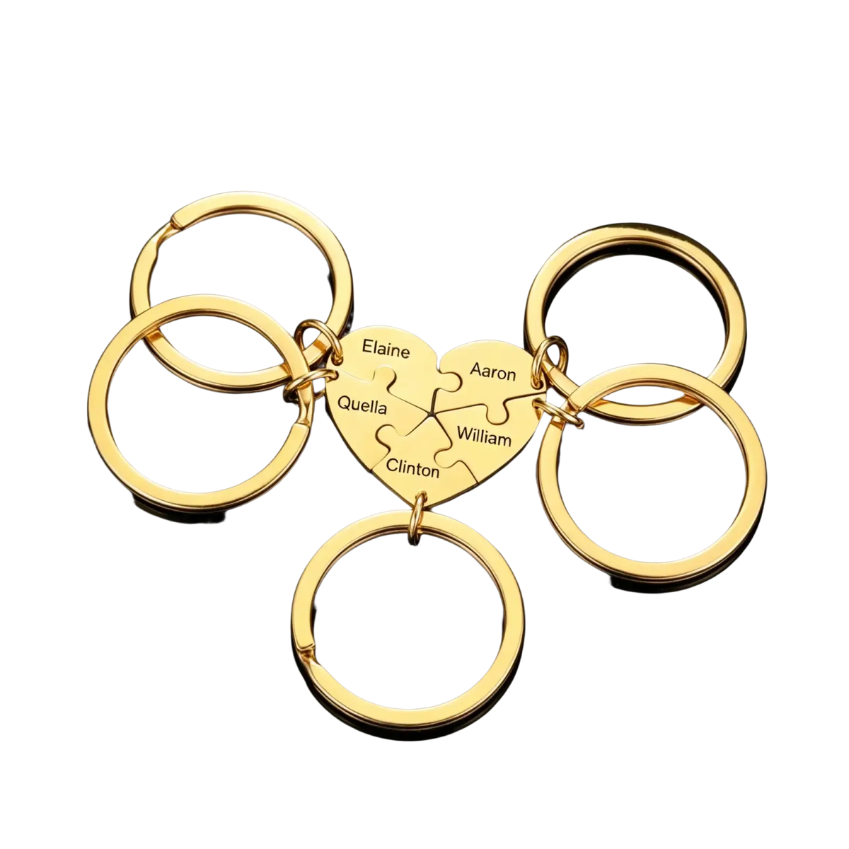 Custom family puzzle heart keychain in gold color featuring engraved names elaine aaron quella william and clinton