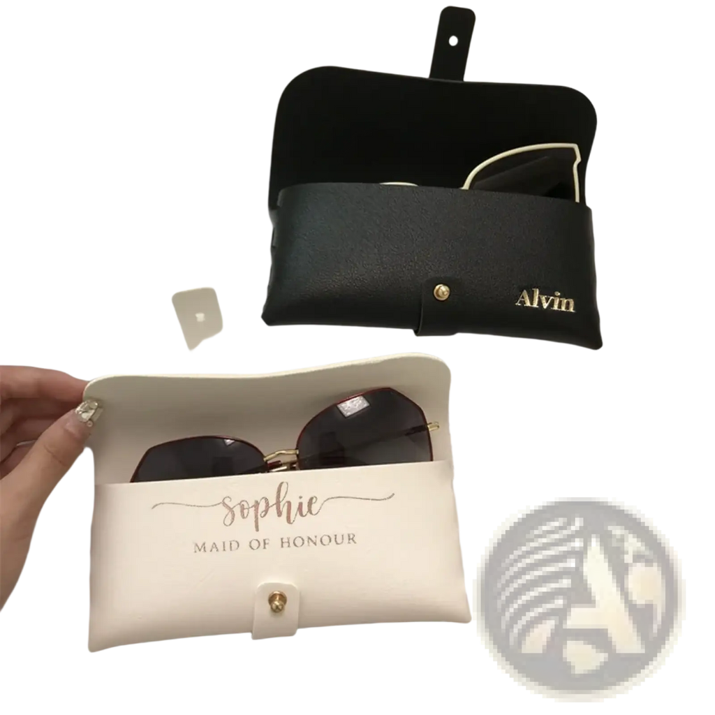 Cream-colored leather glasses case with gold embossed sophie maid of honour script and matching gold clasp for bridesmaids