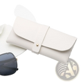 Cream-colored leather sunglasses case with gold-tone button closure personalized as a bridesmaid gift