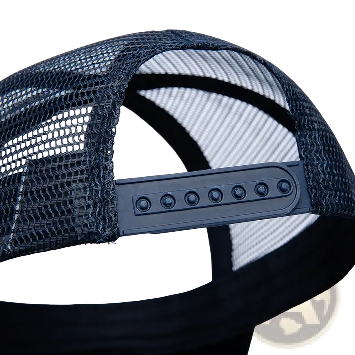 Black mesh trucker hat with custom logo and adjustable plastic back strap shown from the back side