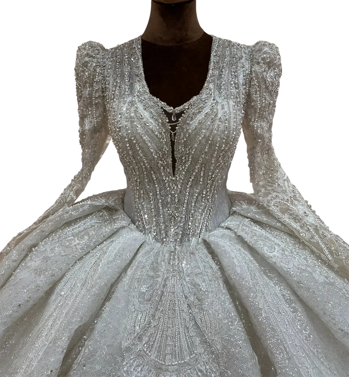 A shimmering silver custom long sleeve lace ball gown wedding dress with intricate beading and voluminous skirt