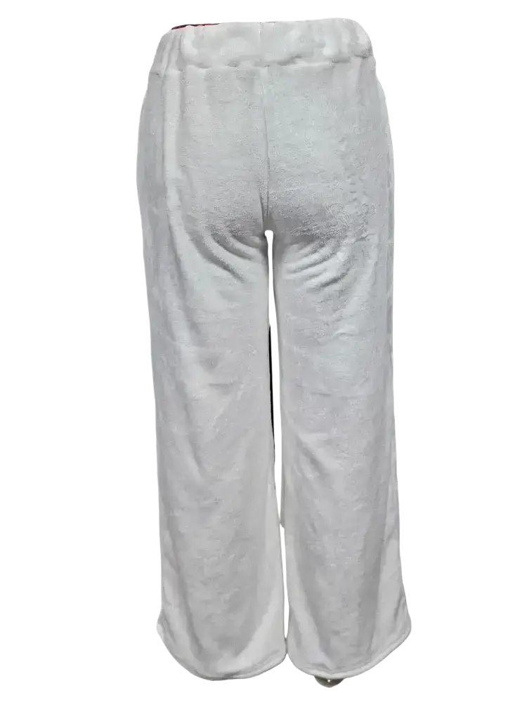 White soft-textured custom lounge pants with elastic waistband and loose fit for comfortable casual wear
