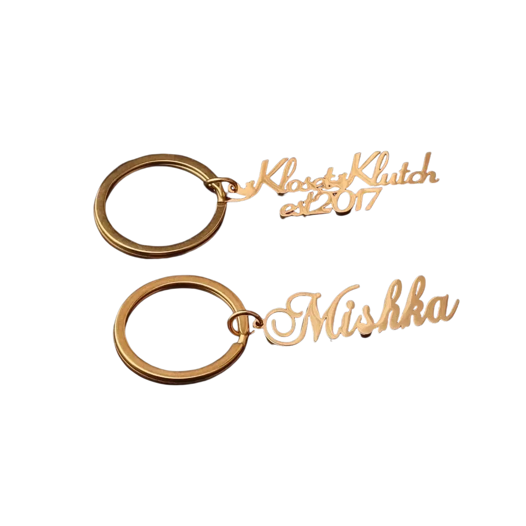 Gold-colored stainless steel custom name keychains engraved with kloset klutch est 2017 and mishka names gift
