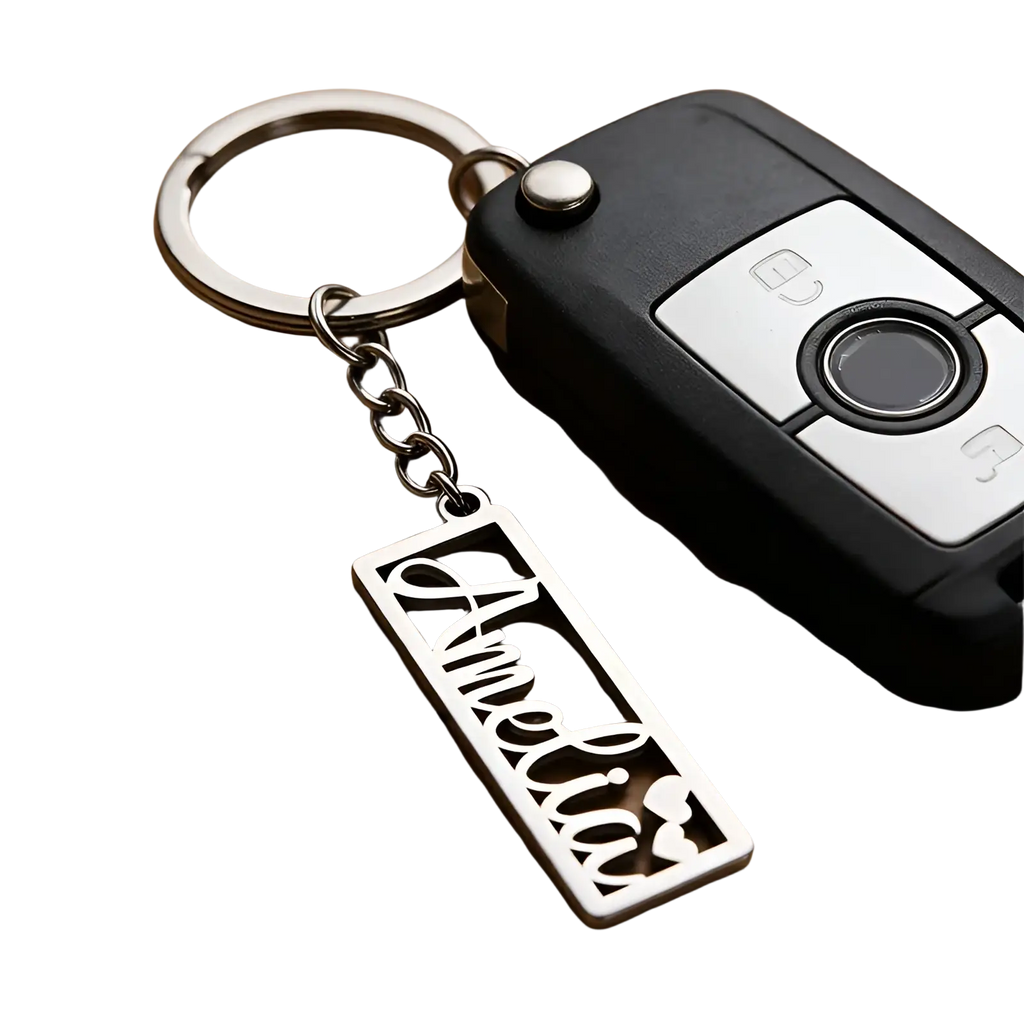 Silver stainless steel custom name keychain with amelia in cursive and two small heart shapes on a rectangular tag