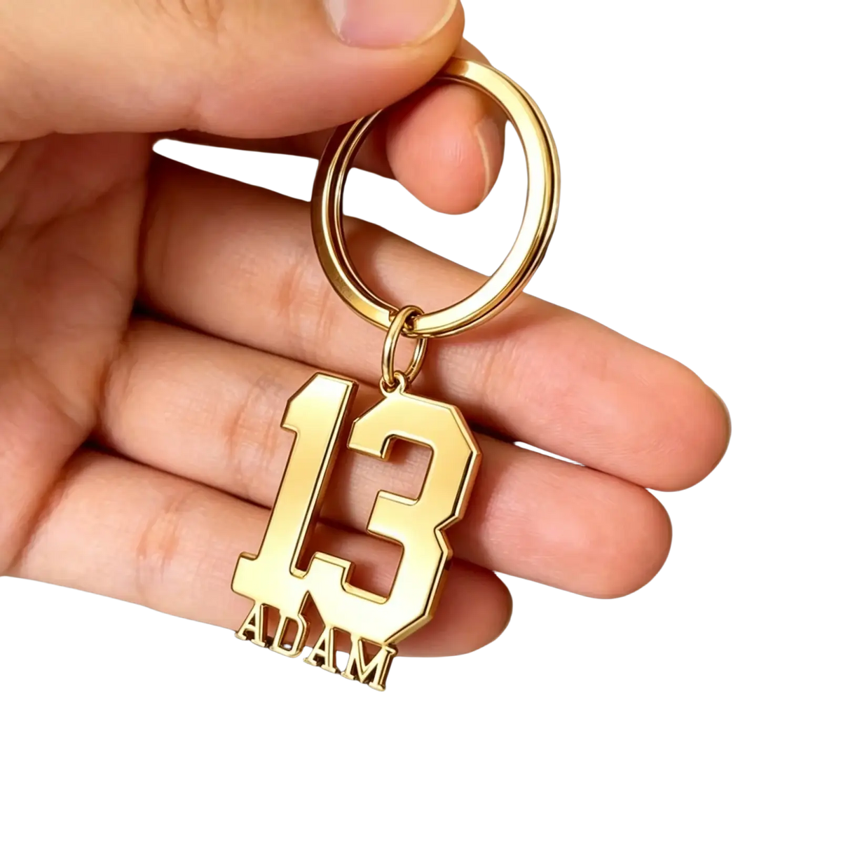 Custom number and name keychain in gold color with number 13 and name Adam engraved in bold blocky font
