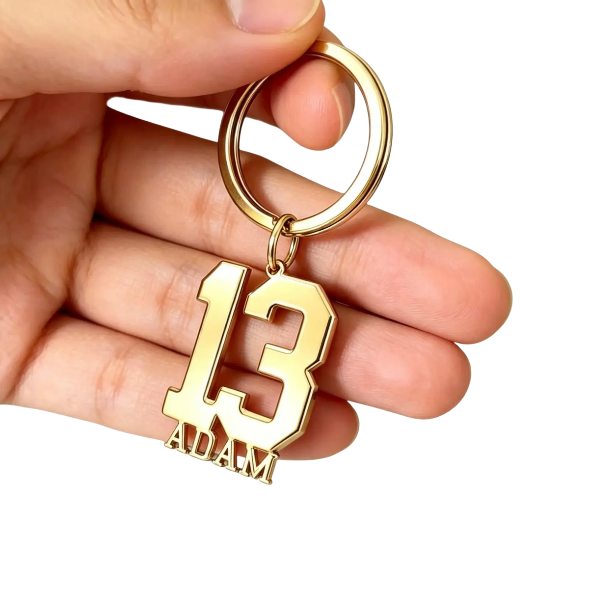 Gold-colored metal custom number and name keychain with bold cut-out 13 and name adam in matching lettering