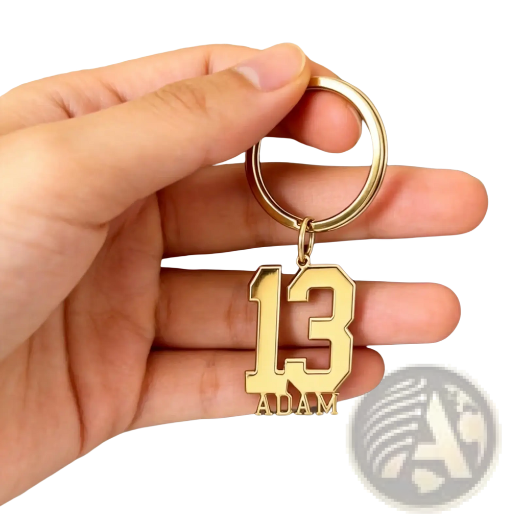 Gold-colored personalized custom number and name keychain featuring number 13 and name Adam in bold block font