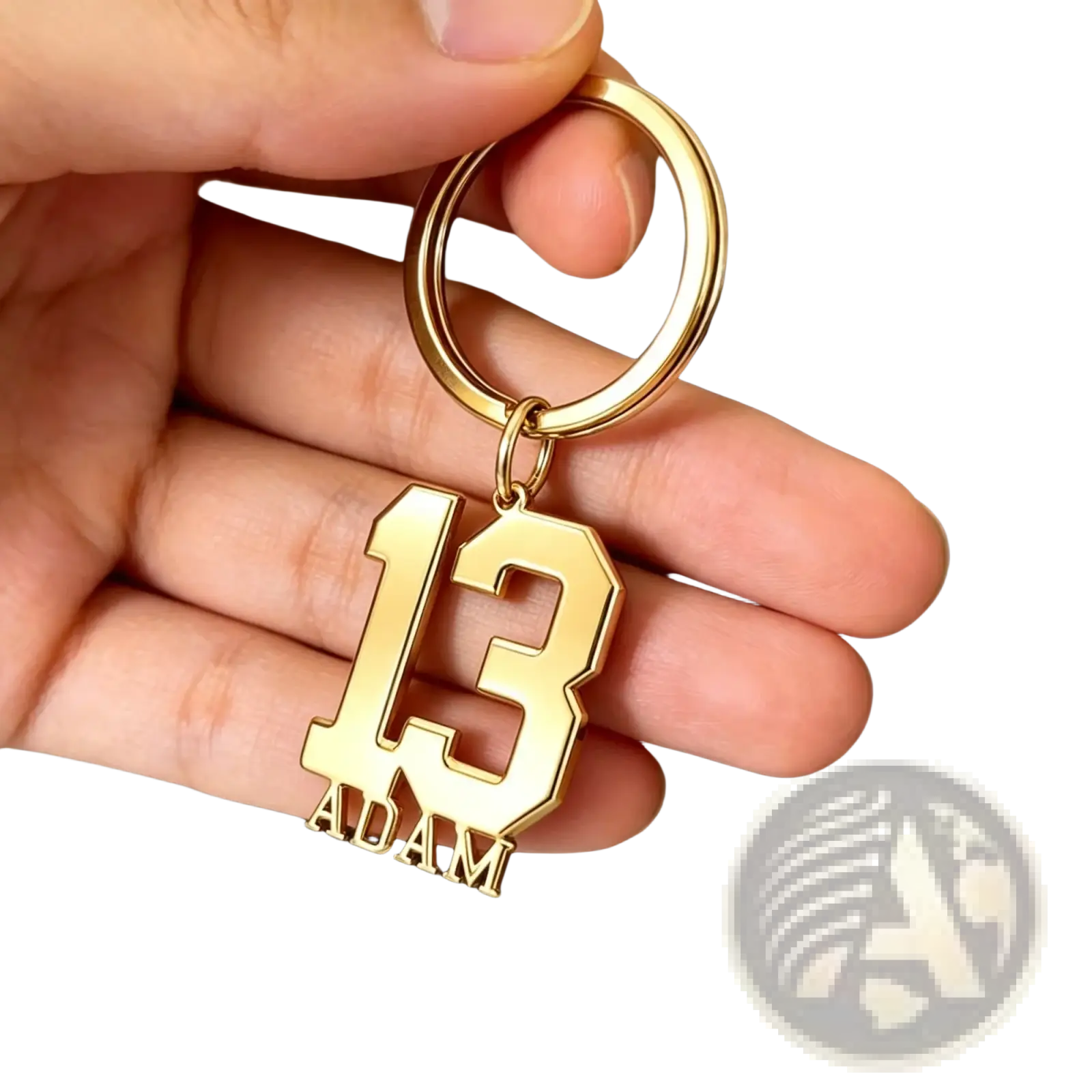 Custom number and name keychain in gold color with number 13 and name Adam engraved in bold blocky font