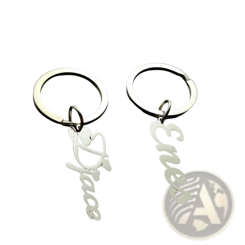 Silver metallic custom personalized name keychains in stainless steel featuring love and peace cursive script designs