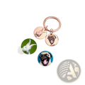 Rose gold custom personalized pet portrait keychain with two engraved circular charms featuring pet images