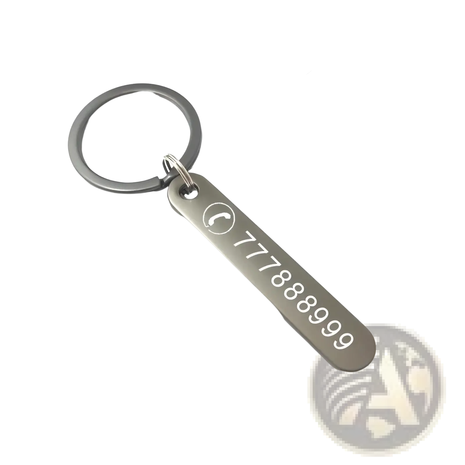 Silver metallic custom phone number keychain with laser engraved 777888999 and phone icon on a rectangular tag
