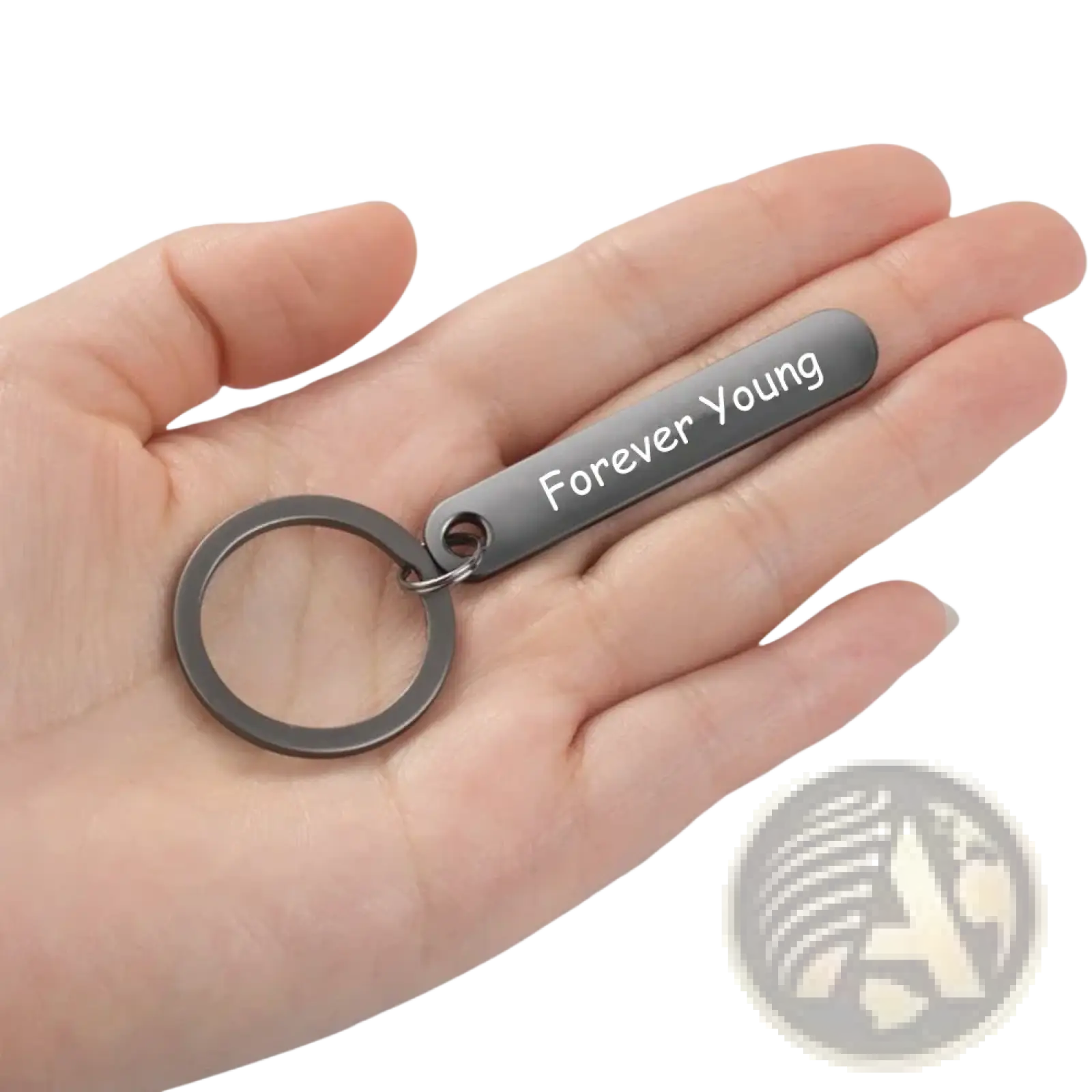 A sleek matte-finished metal custom phone number keychain with laser engraved rectangular tag forever young