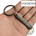 Black metal keychain with rectangular laser engraved tag displaying a phone number and logo for customization