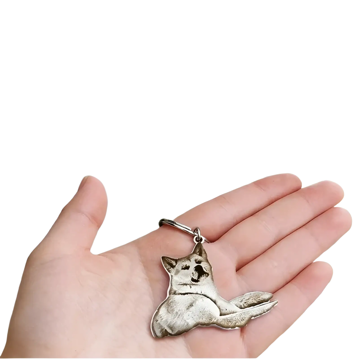 Silver-colored custom photo engraved stainless steel keychain pendant shaped like a reclining akita dog