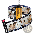 Custom photo film roll keychain featuring a black and yellow film reel pendant with printed couple photos and love you heart design