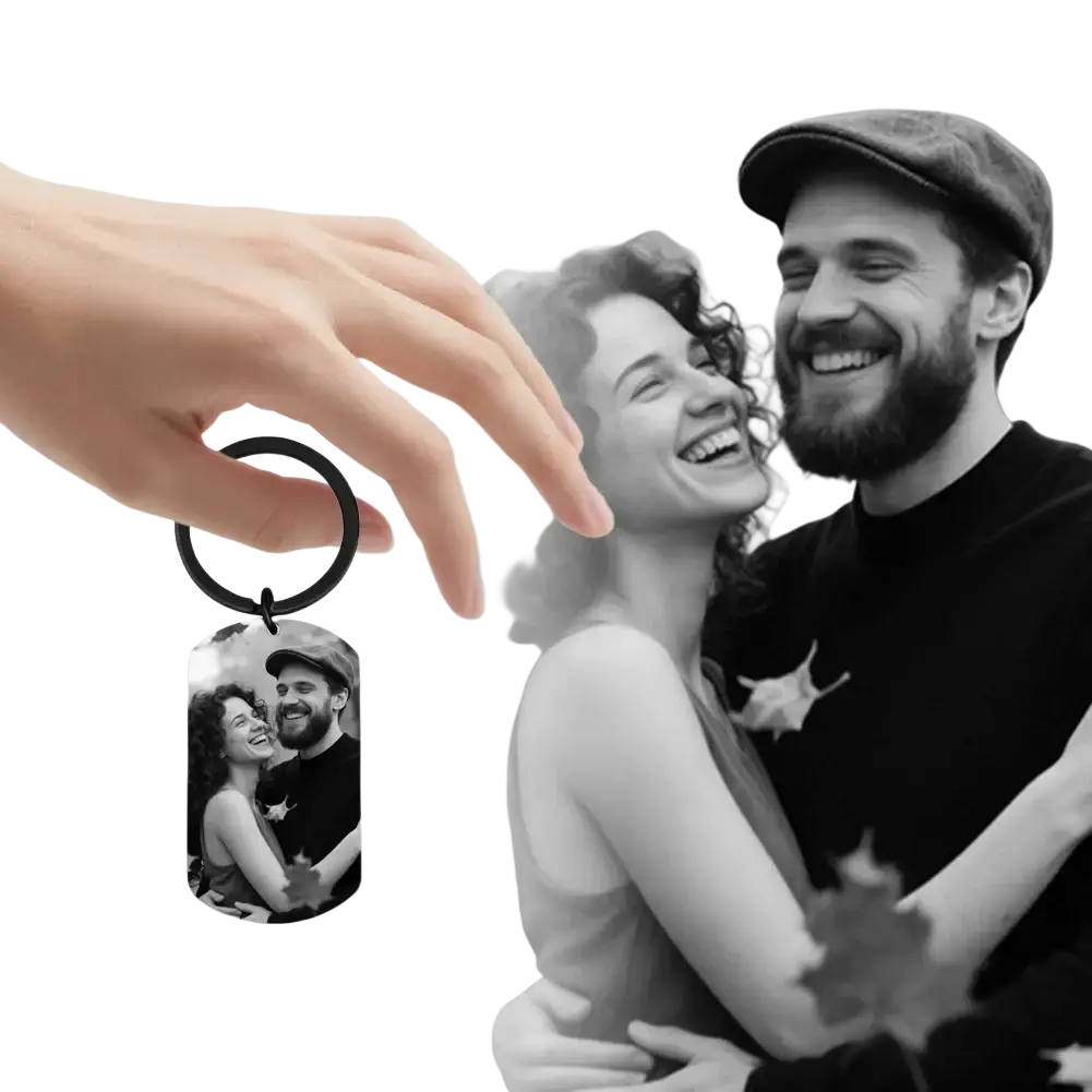 Black metal dog tag keychain featuring a personalized photo of a smiling couple for custom photo keychain for couples