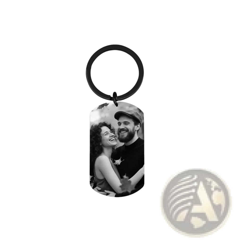 Black metal dog tag keychain with a black-and-white photo of a smiling couple for custom photo keychain for couples