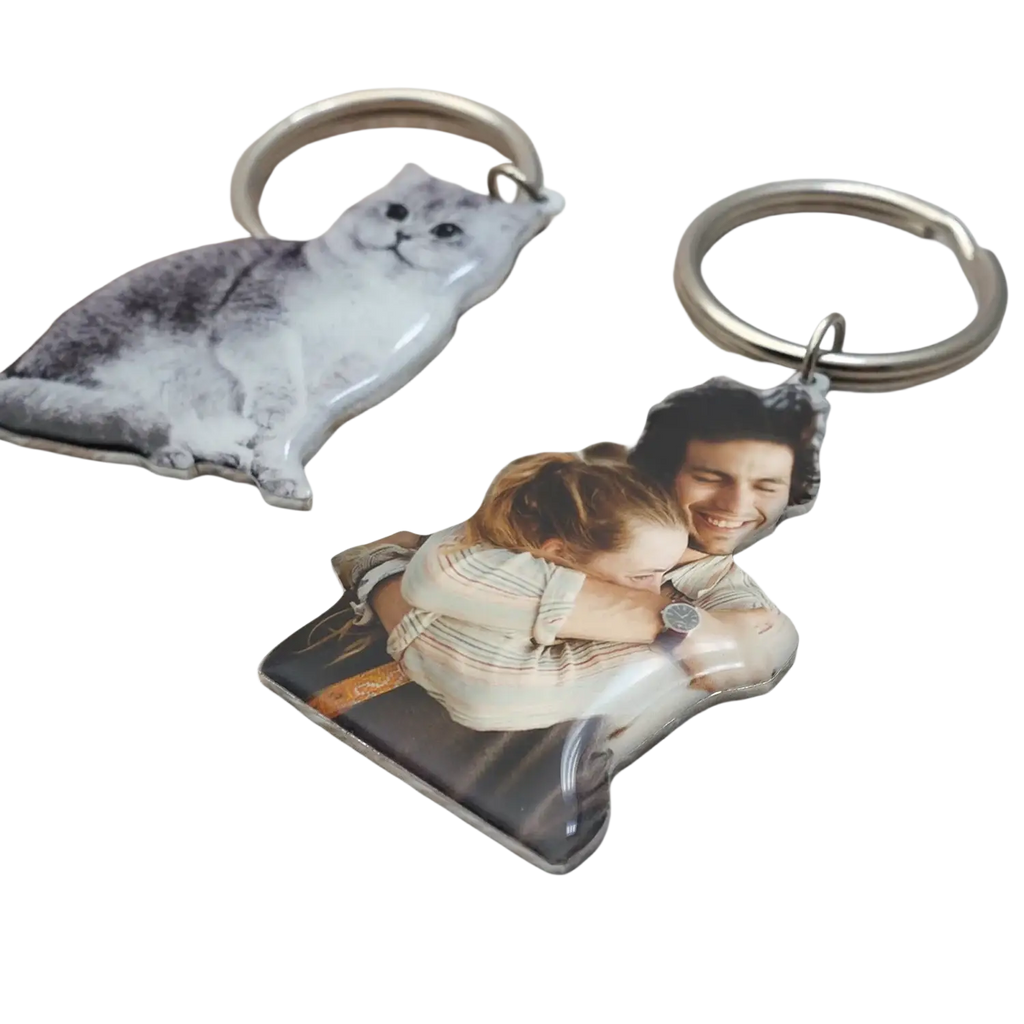 Personalized photo keychain with a printed image of two people embracing made from durable metal for custom use