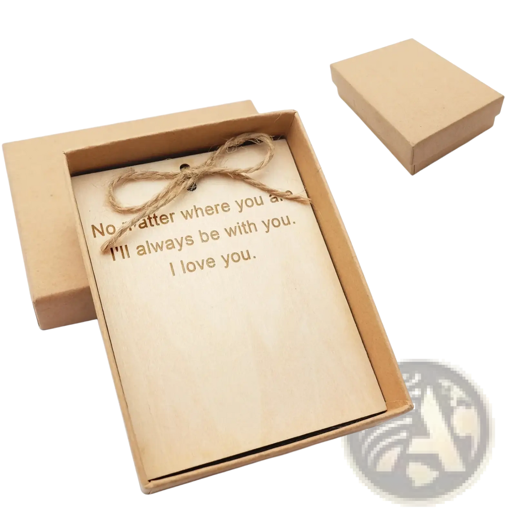 A light brown wooden plaque with engraved text and rustic twine bow for a custom photo keychain keyring