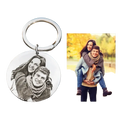 Silver circular stainless steel keychain with black and white engraved portrait of two smiling people custom photo pendant