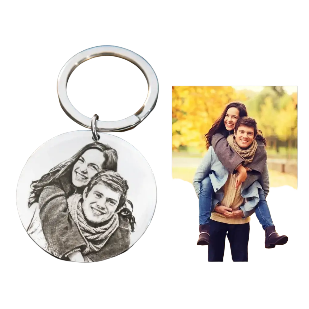Silver circular stainless steel keychain with black and white engraved portrait of two smiling people custom photo pendant