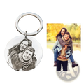 Silver circular stainless steel keychain with black and white engraved portrait of two smiling people custom photo pendant