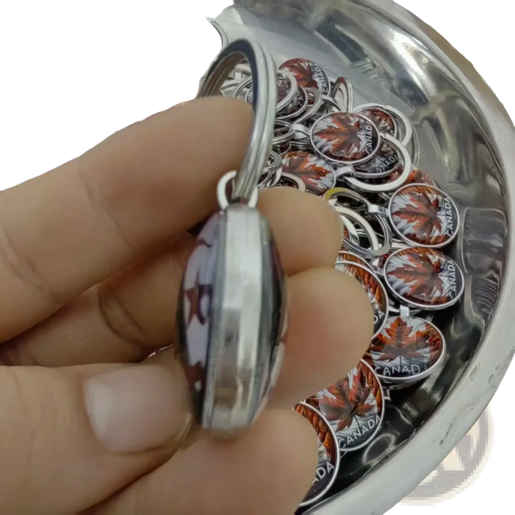 Custom photo logo silver keychain with circular transparent cover featuring an orange maple leaf and canada text