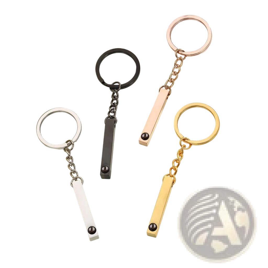 Four sleek metal custom photo projection keychains in silver black rose gold and yellow gold for personalized memorial gifts