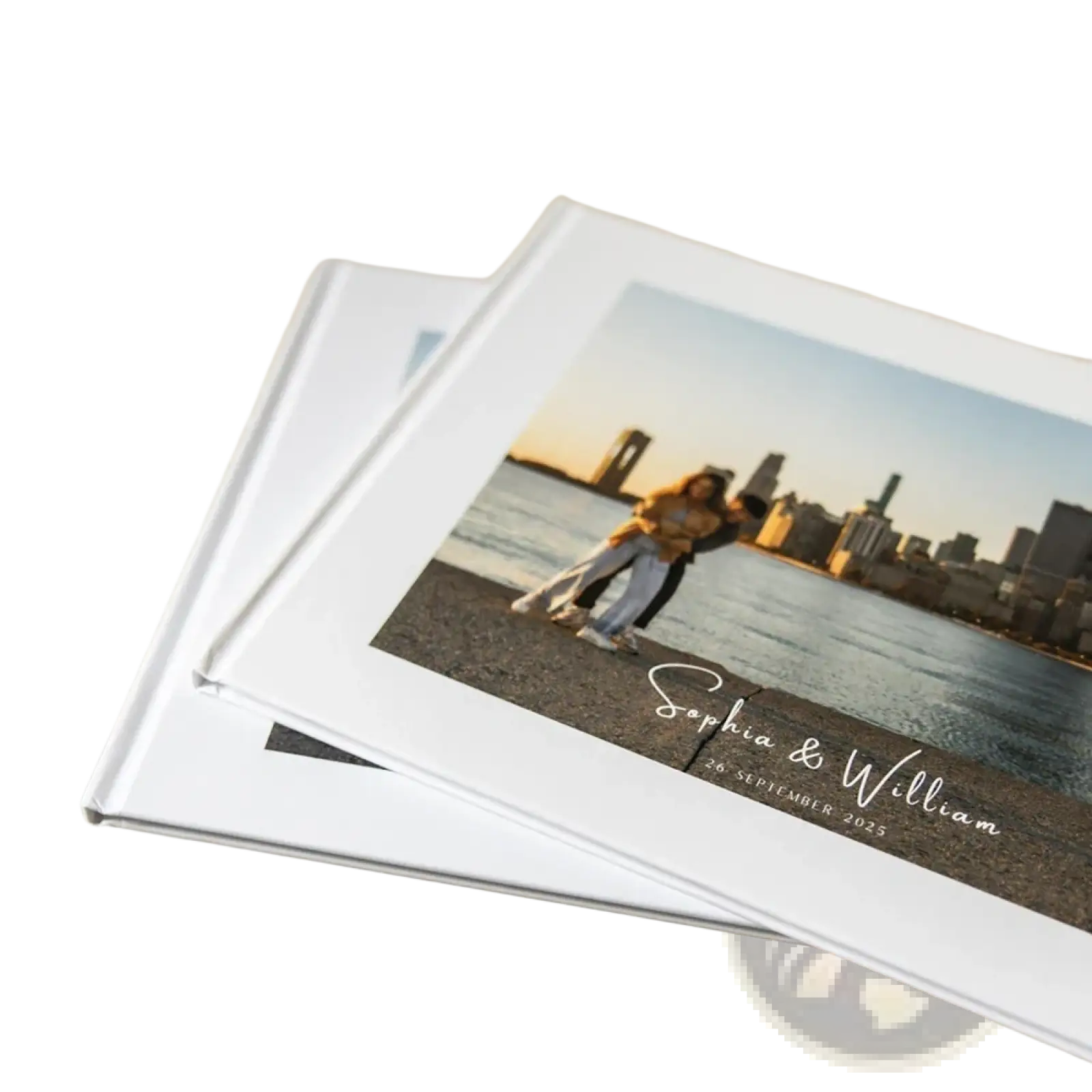 White hardcover custom photo wedding guest book personalized with couple embracing by water and city skyline background