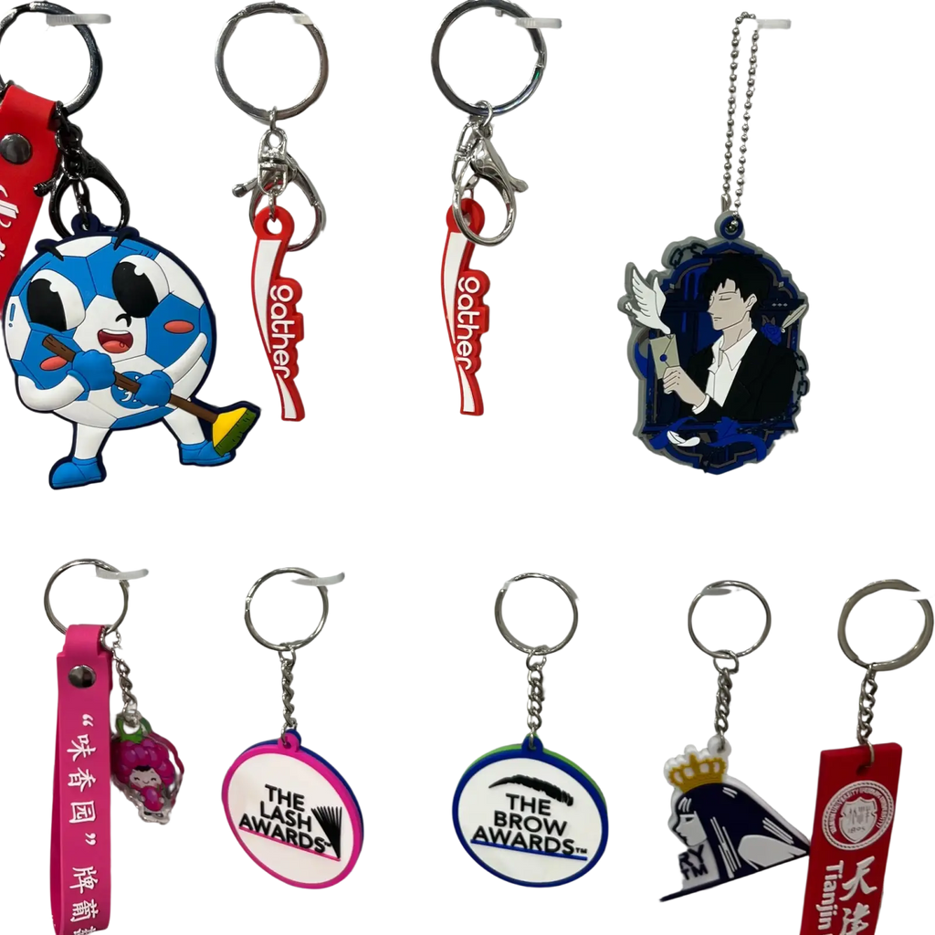 Custom PVC keychain featuring a blue and white cartoon character with black eyes holding a broom rubber logo key ring