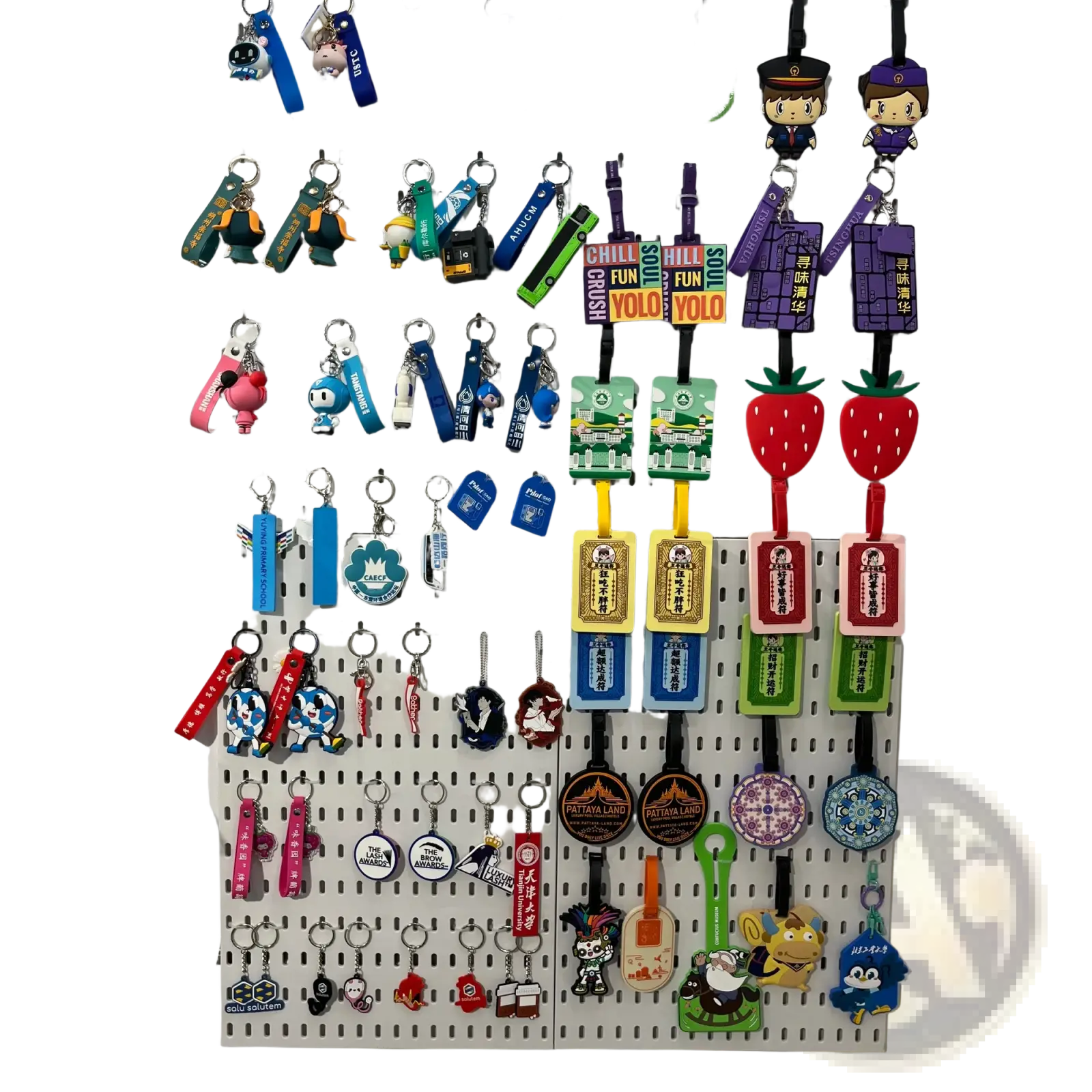 A colorful collection of custom pvc keychains with personalized rubber logos featuring cartoon characters and branded designs