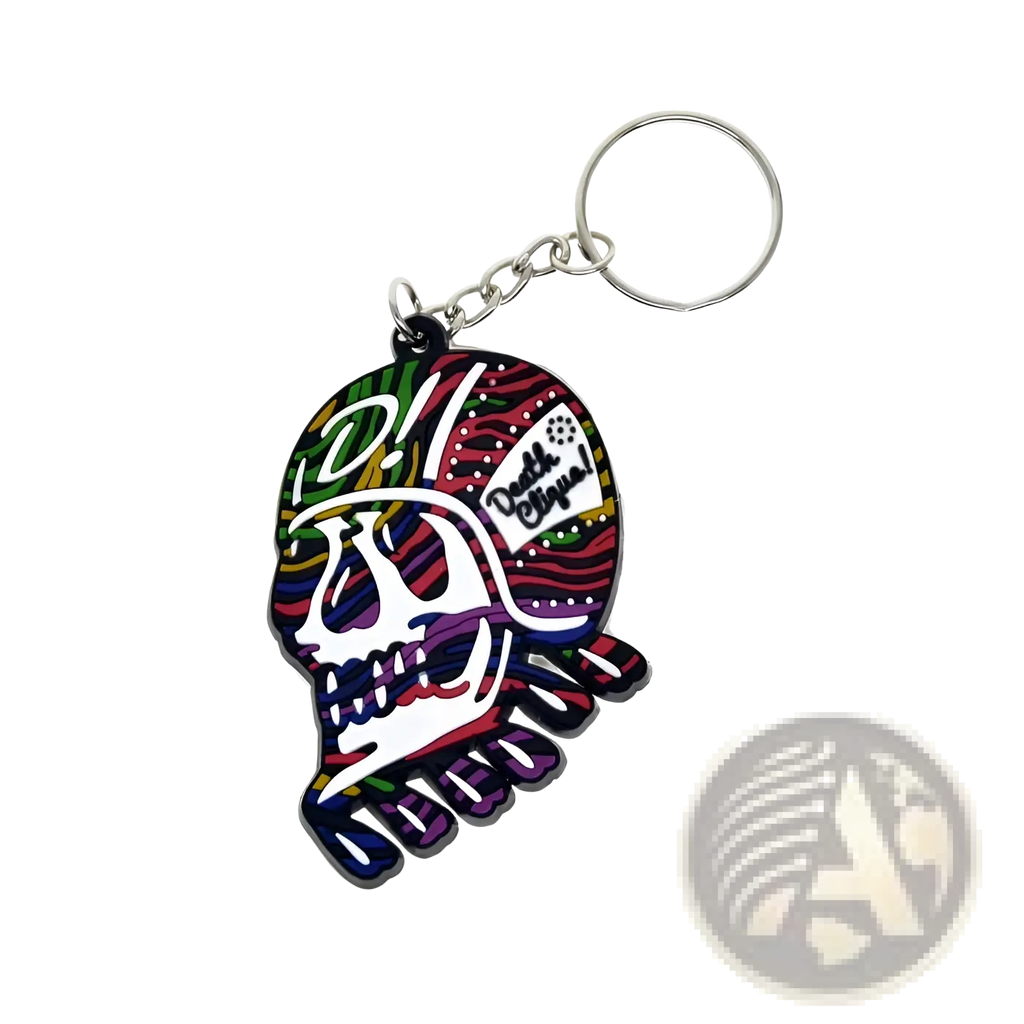 Custom soft pvc keychain featuring a colorful multicolored skull design with a silver metal ring and chain
