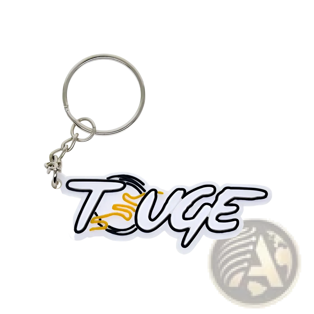 Custom soft PVC keychain featuring a white and black touge logo with yellow flame design and silver metal ring and chain