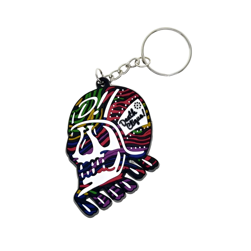 Custom soft pvc keychain featuring a colorful multicolored skull design with a silver metal ring and chain