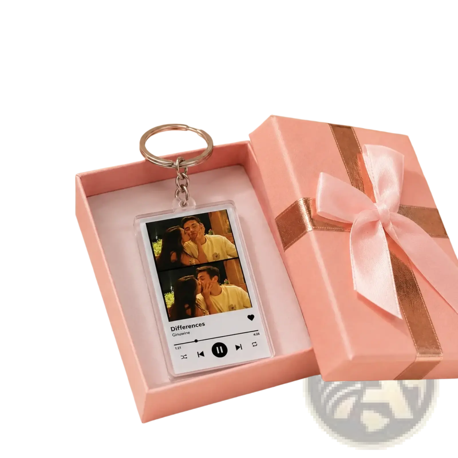 Pink gift box with satin ribbon open to reveal custom acrylic spotify music player keychain featuring couple photos